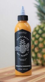 heartbeat hot sauce co pineapple habanero bottle image